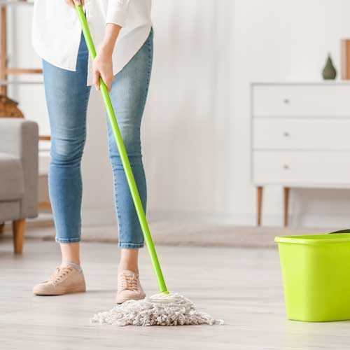 Lady cleaning floor | Carpetland USA Wisconsin